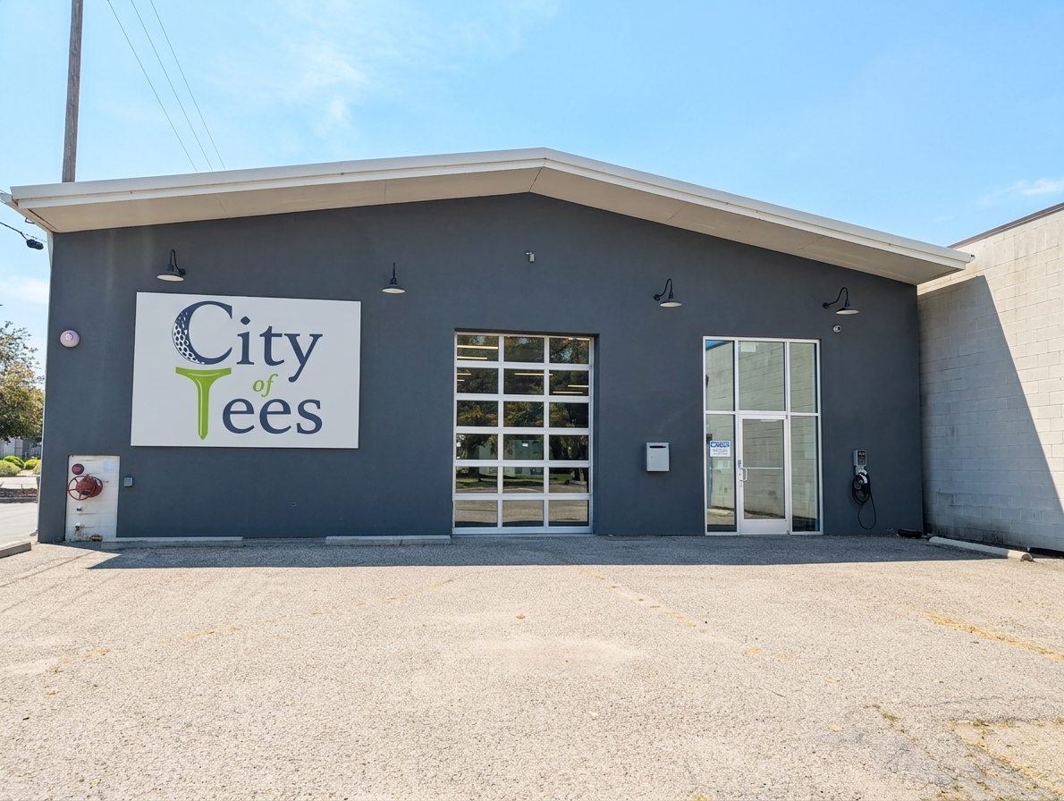 Concept rendering of the building with City of Tees signage, a glass overhead door, and a glass entry door
